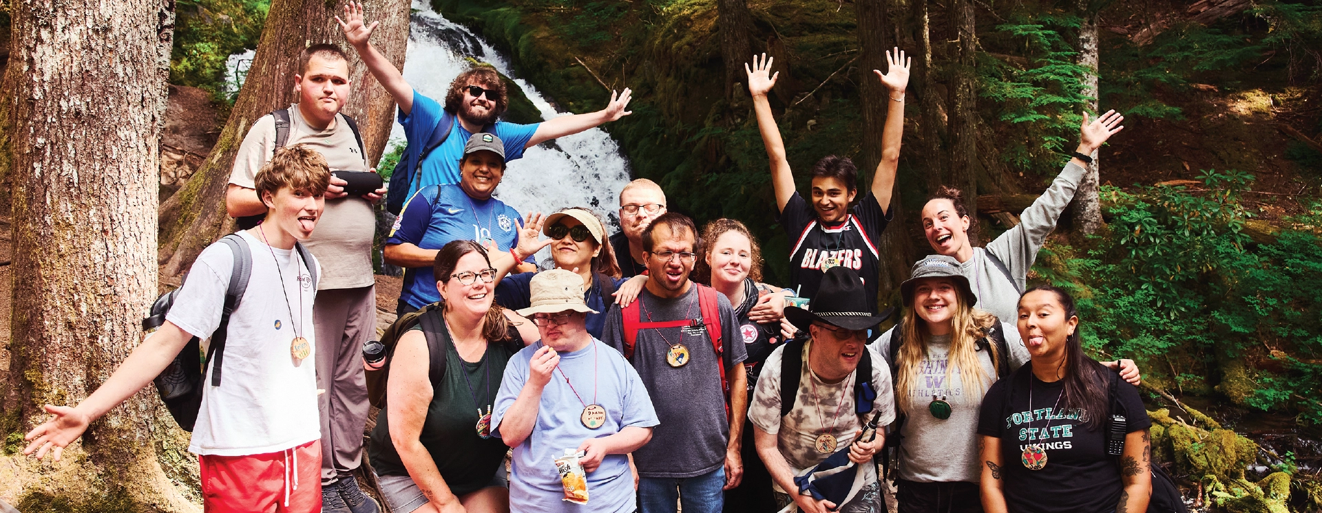 MHKC campers and counselors gathered together by a waterfall
